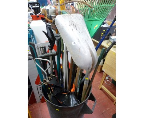 Plastic bin containing various long handled garden tools etc