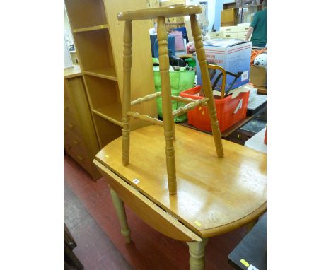 Light wood breakfast table with drop leaf and a wooden stool