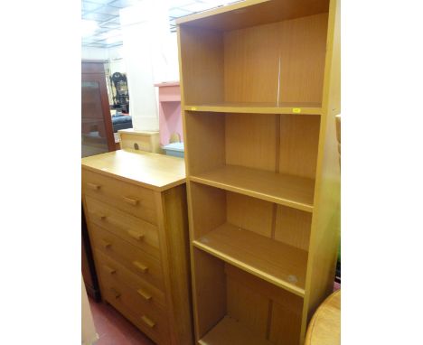 Modern light wood chest of five drawers and a slim four shelf bookcase