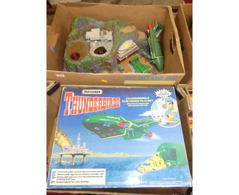 A Matchbox Thunderbird 2 electronic play set together with a loose Tracy Island play set, also sold with a Hong Kong issue No