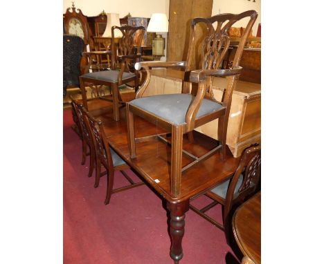 A Victorian mahogany round cornered extending dining table, having pull-out action, three extra drop-in leaves, raised on tur
