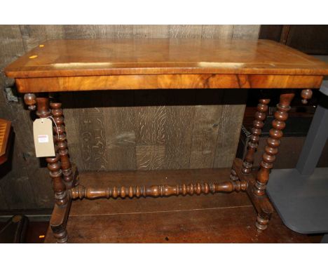 A Victorian figured walnut round cornered hall table, on twin bobbin turned end supports, width 86.5cm