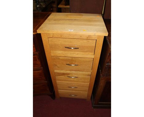 A contemporary light oak narrow chest of five long drawers, w.51cm 