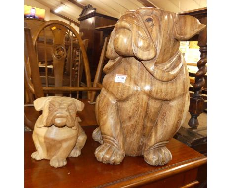 A contemporary carved teak model of a seated pug dog, h.41cm; together with one other similar smaller softwood carved example