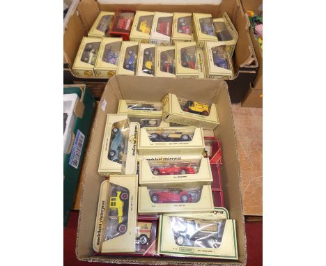 Two trays containing a quantity of mainly cream window boxed Matchbox Models of Yesteryear to include a Harrods 1922 Ford Mod