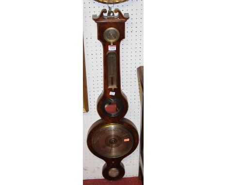 An early 19th century mahogany four-dial wheel barometer, the lower scale signed Feltham, Stowmarket