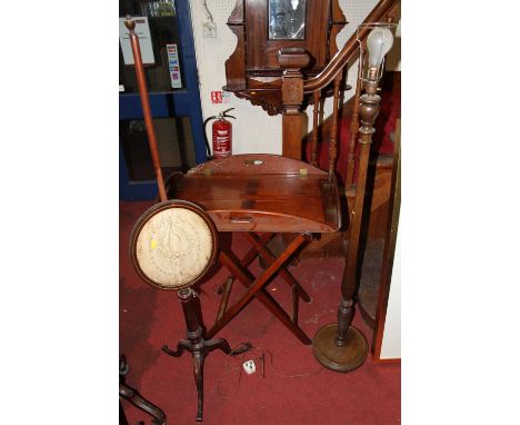 A 19th century mahogany pole screen; together with a butler's tray, having hinged folding sides and on X-framed base; and a f