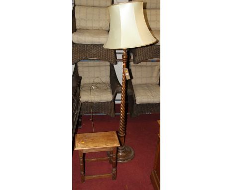 An early 20th century turned walnut standard lamp; together with a joined oak joint stool (2)