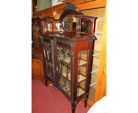 A circa 1900 mahogany Chippendale Revival double door glazed display cabinet, with raised bevelled mirrored superstructure, w