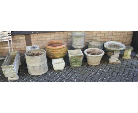 A collection of various reconstituted stone garden planters, terracotta floral decorated planter, scallop shell bird bath, pe