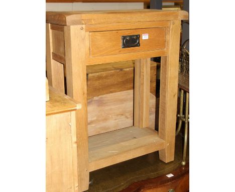 A contemporary light oak single drawer two-tier lamp table, width 60cm