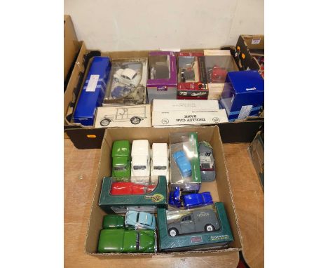 Two trays containing a quantity of mixed modern issue diecast to include an ERTL trolley car bank, Corgi Weetabix issue dieca