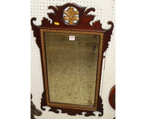 A circa 1900 mahogany fret cut and partial gilt decorated bevelled rectangular wall mirror, in the Chippendale taste, 87 x 46