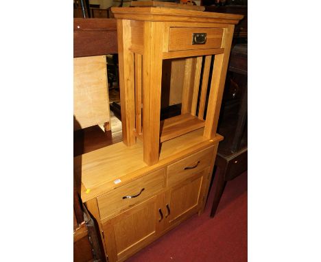 A contemporary light oak double door side cupboard, with twin upper drawers, width 99cm, together with a matching two-tier si