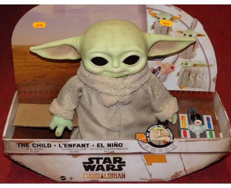 A Star Wars Mandalorian by Mattel The Child plush action figure