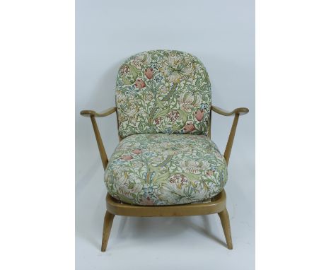 An Ercol beech and elm armchair