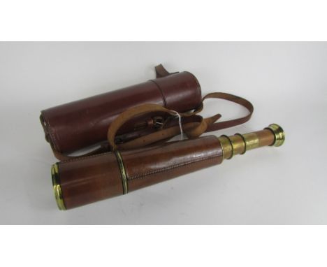 A cased brass telescope in a fitted leather case, the brass extending section stamped "Broadhurst Clarkson &amp; Co, 63 Farri