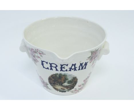A 20th century ceramic cream pale, with transfer decoration of farm scene, 20cm high, 28cm diameter