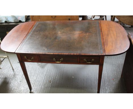 An early 19th century mahogany sofa table, with two short drawers and one long drawer, brass swing handles, black leather des