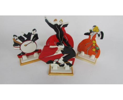Four Clarice Cliff ceramic models of musicians by Wedgwood