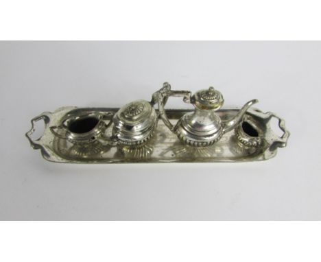 An electroplated miniature four piece tea and coffee service, with a tray
