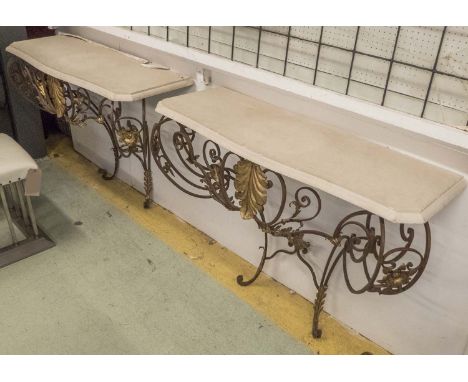 CONSOLE TABLES, a pair, Art Deco style, wrought iron and gilded with serpentine stone tops, 89cm H x 115cm W x 43cm D. (2)