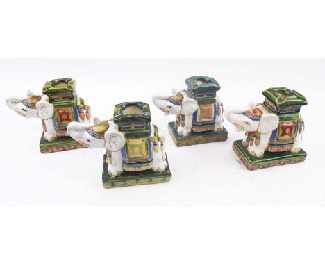 ELEPHANT TABLE CANDLESTICKS, a set of four, Asian ceramic, each 16cm L x 13.5cm H max. (4)