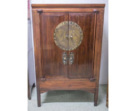 MARRIAGE CABINET, Chinese lacquered of two doors with engraved brass fittings enclosing a hanging rail, shelf and two drawers