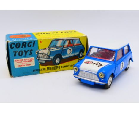 Corgi - A boxed Morris Mini Cooper Competition model in blue with a white bonnet and roof and racing number 3. # 227. The car