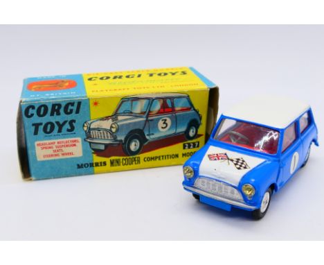 Corgi - A boxed Morris Mini Cooper Competition model in blue with a white bonnet and roof and racing number 1. # 227. The car