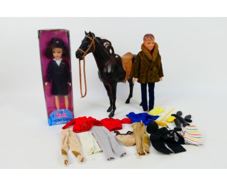 Pedigree - Sindy - Paul - A boxed modern issue 1960s Sindy in BOAC cabin crew uniform, a 1965 Paul doll, a vintage horse and 