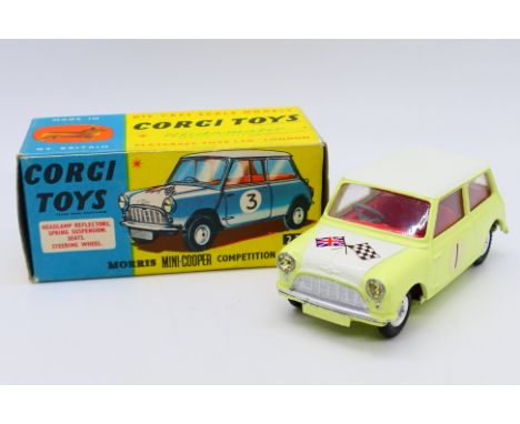 Corgi - A boxed Morris Mini Cooper Competition model in Primrose yellow with a white bonnet and roof and racing number 1. # 2