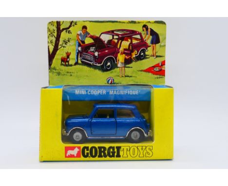 Corgi - A boxed B.M.C. Mini Cooper S 'Magnifique' in blue # 334. The car appears in Near Mint condition with only a couple of