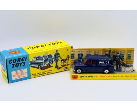 Corgi - A boxed B.M.C. Mini Police van with Policeman and tracker dog # 448. The model appears Near Mint with a few minor mar