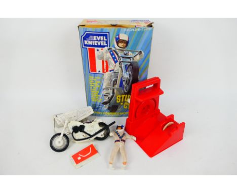 Ideal Toys - A #3407-4 Evel Knievel Stunt Cycle with gyro powered launcher and Evel Knievel action figure, with operating ins