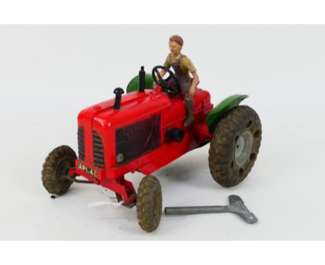 Tri-ang Minic - A large clockwork Nuffield series II tractor. The model measures 20 cm long and still has its key, driver fig