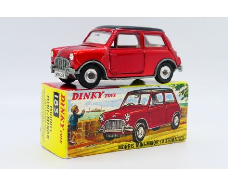 Dinky - A boxed Morris Mini Minor Automatic in metallic red with gloss black roof # 183. The car appears Near Mint with just 