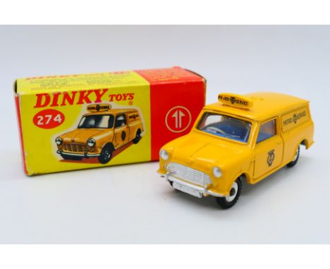 Dinky - A boxed AA Mini Van in all yellow finish # 274. The model appears in Near Mint condition with a just a few tiny marks