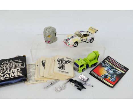 Transformers - Takara - Hasbro - Change Robo - Maruka. A selection of Four Transformer and Transformer related items appearin