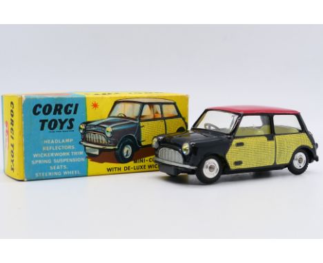 Corgi - A boxed Morris Mini Cooper with De-Luxe Wickerwork # 249. The car appears Near Mint with just some scuff marks to its