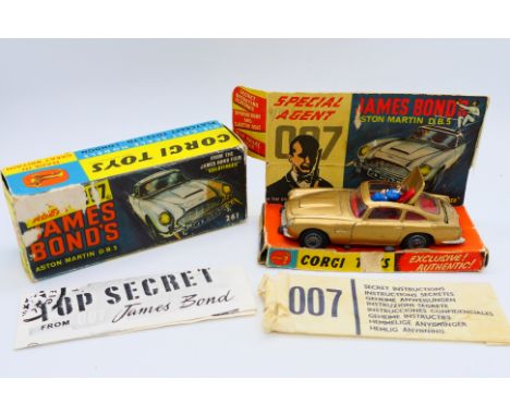 Corgi Toys - A boxed Corgi Toys #261 James Bond Aston Martins DB5. The original gold coloured vehicle comes with villain figu
