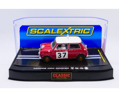 Scalextric - A cased Paddy Hopkirk 1964 Morris Mini Cooper S # C2919. The model appears Mint and unused in a Very Good displa