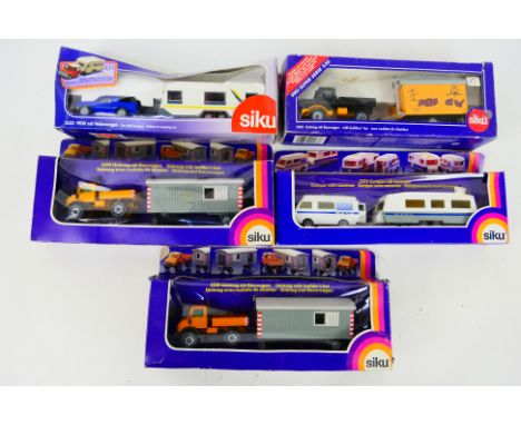 Siku - Five boxed 1:55 scale diecast vehicle sets from Siku. Lot consists of #2533 Unimog with Builders Hut; #2519 Unimog wit
