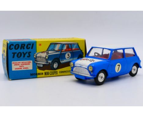 Corgi - A boxed Morris Mini Cooper Competition model # 227. This version is in blue with white bonnet and roof, red interior 