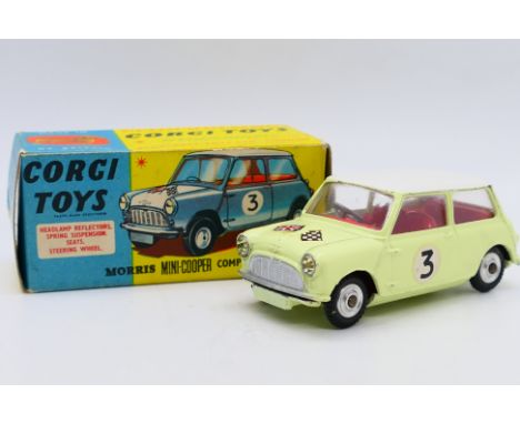 Corgi - A boxed Morris Mini Cooper Competition model # 227. This version is in Primrose yellow with white roof and racing num