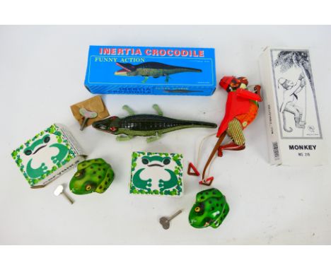 Vyritsky, Other - 4 x boxed tinplate models - Lot includes 2 x tinplate Vyritsky frogs with wind-up keys. A tinplate Inertia 