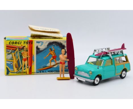Corgi - A boxed Surfing with the BMC Mini Countryman set # 485. The Mini appears in Mint condition with the surfer figure and