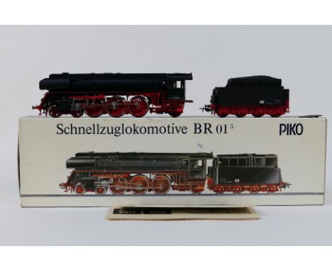 Piko - A boxed Piko #5/6325 BR01 4-6-2 HO gauge steam locomotive and tender. The model appears to be in Mint condition sittin