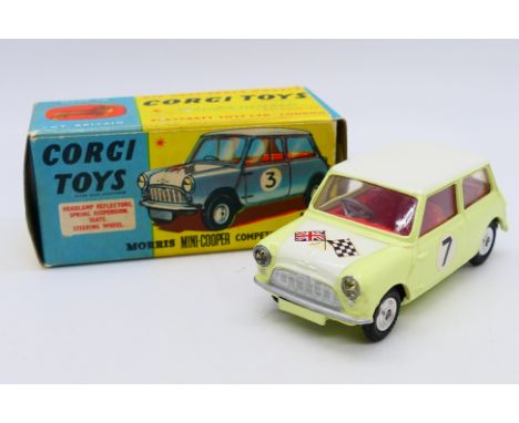 Corgi - A boxed Morris Mini Cooper Competition model in Primrose yellow with a white bonnet and roof and racing number 7. # 2