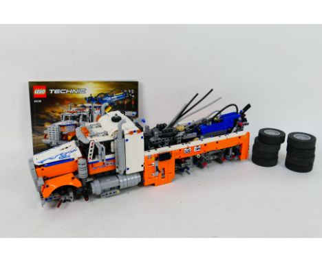 Lego - An unboxed and built Lego Technic heavy-duty tow truck #42128 .Model appears to be in dusty condition. Comes with inst
